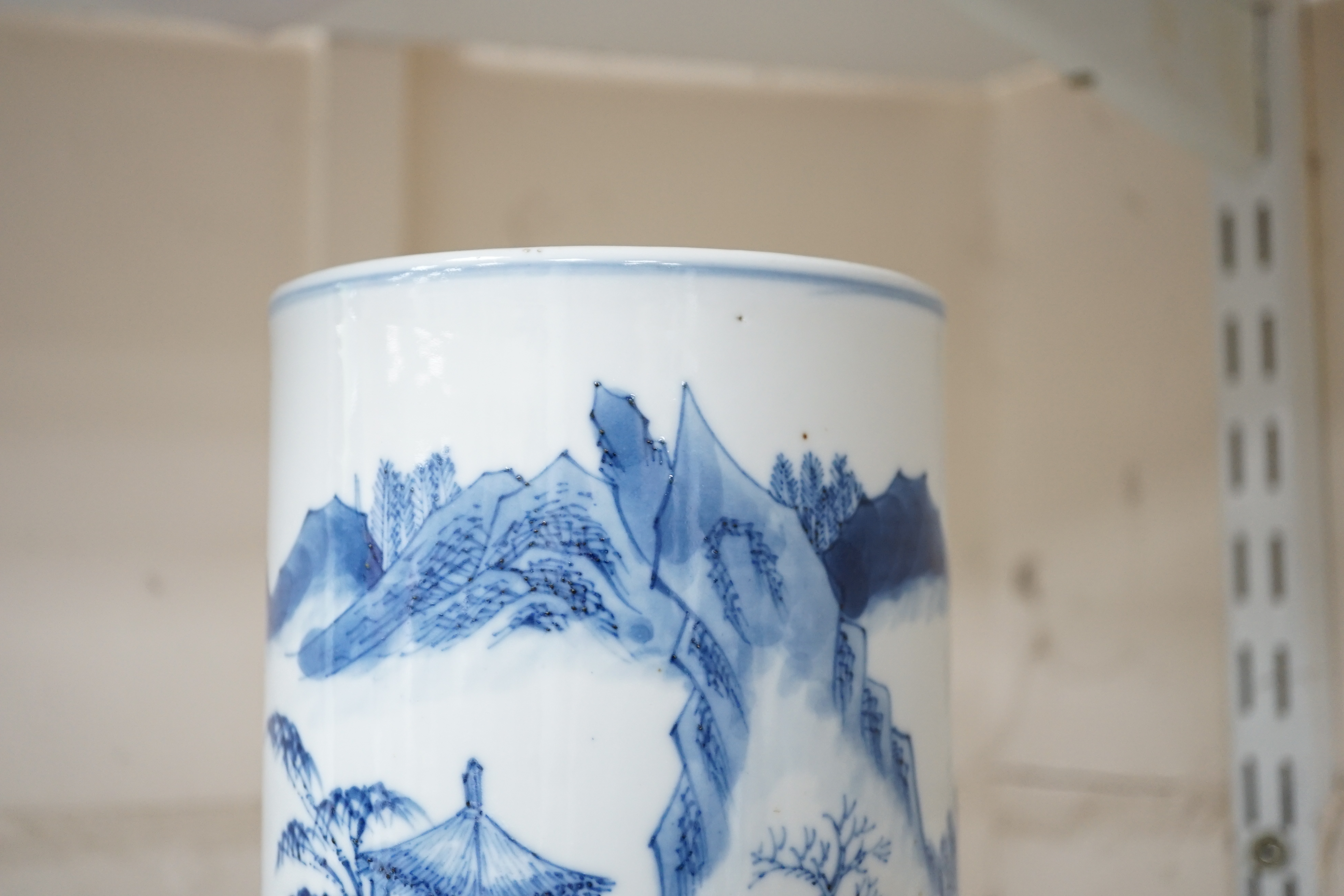 A Chinese blue and white ‘sages’ cylindrical brushpot, 19th century